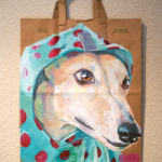 Greyhound painting wearing a polka dot rain slicker